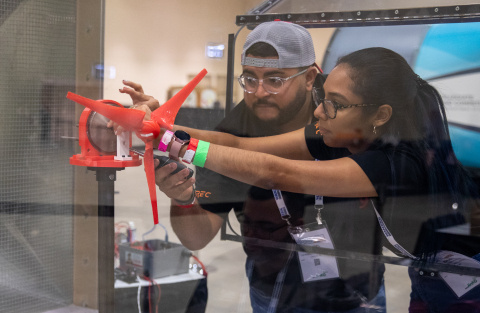 Two CWC participants set up a model turbine.