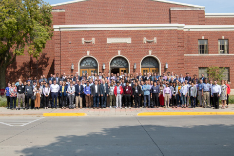 Large group of people in front of a large building.
