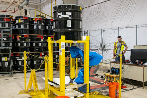An Integrity Assessment Group employee supervises an evaluation of ultrasonic testing technology.