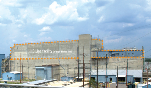 An orange dotted line around a large grey building highlighting the top half of it