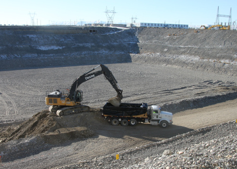 Work vehicles work to clear an area on the Hanford Site