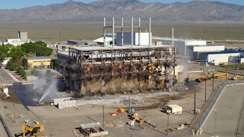 Demolition taking place of a reactor building, fire and explosions occur at the bottom of the building