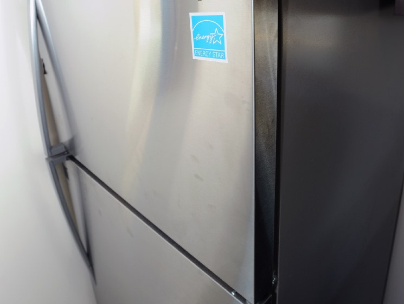 A stainless steel fridge with an ENERGY STAR sticker