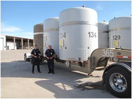 Idaho State Patrol Troopers Rick Stouse and Tony Anderson inspected the TRUPACTS, containers which contain TRU waste, and trailer containing the final shipment of Hanford offsite waste. The Idaho State Patrol officers have played an important role in AMWTP's success by inspecting every one of AMWTP's nearly 3,900 shipments. Idaho State Patrol Troopers Rick Stouse and Tony Anderson inspected the TRUPACTS, containers which contain TRU waste, and trailer containing the final shipment of Hanford offsite waste. The Idaho State Patrol officers have played an important role in AMWTP's success by inspecting every one of AMWTP's nearly 3,900 shipments.