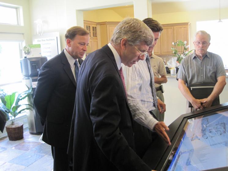 Deputy Secretary Daniel Poneman sees firsthand how new in-home monitors help consumers save money. <a href = "http://energy.gov/photos/how-smart-grid-helps-homeowners-reduce-their-energy-use">Click here to see more photos</a> and learn how new smart grid technology can help you save. | Energy Department Image | Photo by Jen Stutsman Deputy Secretary Daniel Poneman sees firsthand how new in-home monitors help consumers save money. <a href = "http://energy.gov/photos/how-smart-grid-helps-homeowners-reduce-their-energy-use">Click here to see more photos</a> and learn how new smart grid technology can help you save. | Energy Department Image | Photo by Jen Stutsman