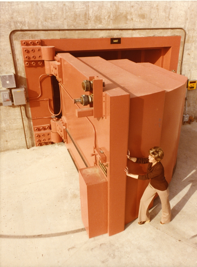 For 35 years, the Energy Department has pursued an all-of-the-above energy strategy — and the critical work done at the National Labs has helped put America at the top of the global clean energy race. This photo from 1979 shows a Lawrence Livermore National Laboratory employee opening the world's heaviest hinged door, which was eight feet thick, nearly twelve feet wide, and weighed 97,000 pounds. A special bearing in the hinge allowed a single person to open or close the concrete-filled door, which was used to shield the Rotating Target Neutron Source-II (RTNS-II) -- the world’s most intense source of continuous fusion neutrons. Scientists from around the world used it to study the properties of metals and other materials that could be used deep inside fusion power plants envisioned for the next century. | Photo courtesy of Lawrence Livermore National Laboratory. For 35 years, the Energy Department has pursued an all-of-the-above energy strategy — and the critical work done at the National Labs has helped put America at the top of the global clean energy race. This photo from 1979 shows a Lawrence Livermore National Laboratory employee opening the world's heaviest hinged door, which was eight feet thick, nearly twelve feet wide, and weighed 97,000 pounds. A special bearing in the hinge allowed a single person to open or close the concrete-filled door, which was used to shield the Rotating Target Neutron Source-II (RTNS-II) -- the world’s most intense source of continuous fusion neutrons. Scientists from around the world used it to study the properties of metals and other materials that could be used deep inside fusion power plants envisioned for the next century. | Photo courtesy of Lawrence Livermore National Laboratory.