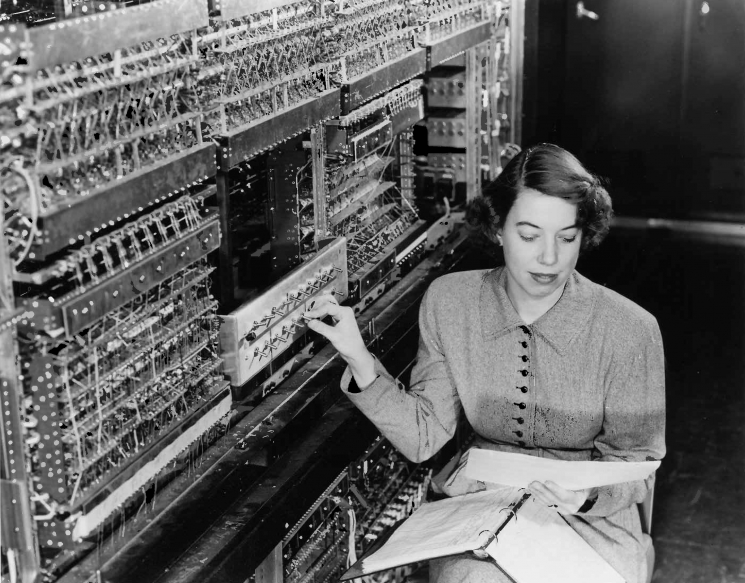 Before there was Google, or even the Internet, there was the computer -- and the earliest computers were so large that just one could occupy an entire room. AVIDAC was the first digital computer at Argonne National Laboratory, and began operating in 1953. It was built by the Physics Division for $250,000. Pictured here, with AVIDAC, is pioneer Argonne computer scientist Jean F. Hall. AVIDAC stands for "Argonne Version of the Institute's Digital Automatic Computer" and was based on architecture developed by mathematician John von Neumann. | Photo courtesy of Argonne National Laboratory.