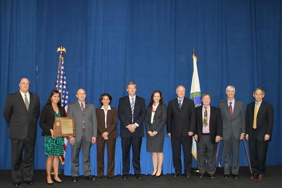 Members of the Depleted Uranium Hexafluoride Tails Re-enrichment Project team gather for a photo with Secretary Chu, far right, after receiving an Achievement Award Thursday. Members of the Depleted Uranium Hexafluoride Tails Re-enrichment Project team gather for a photo with Secretary Chu, far right, after receiving an Achievement Award Thursday.