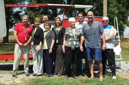 Participants in the campaign from the Portsmouth/Paducah Project Office gather in front of a dunk tank that helped draw in donors to the food drive. Participants in the campaign from the Portsmouth/Paducah Project Office gather in front of a dunk tank that helped draw in donors to the food drive.