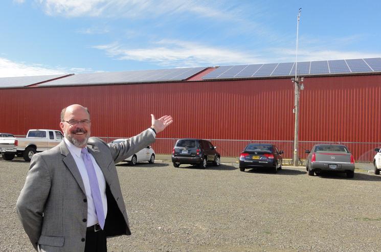 Bob Repine, Oregon Department of Energy director, presents the Benton County Fairgrounds solar barn built with American Recovery and Reinvestment Act funds. The rooftop solar array will produce nearly a quarter of the energy used at the fairgrounds and the 12,000-square-foot space will house livestock and the Solar Education Center. | Photo courtesy of the Oregon Department of Energy