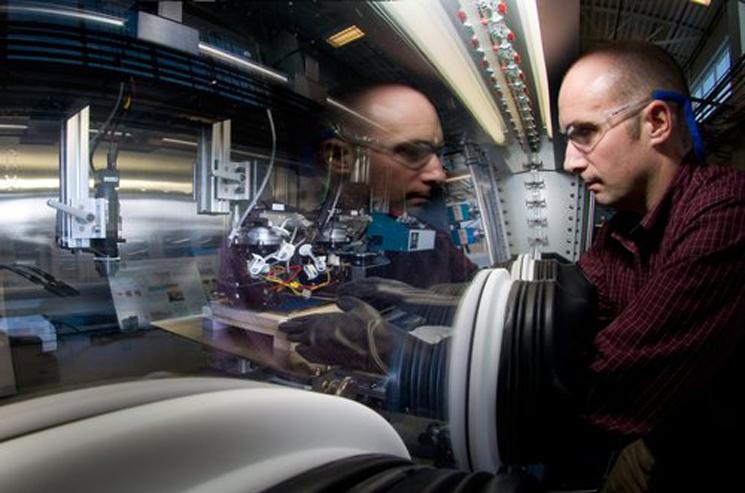 National Renewable Energy Laboratory research scientist Robert Tenent is helping incorporate thin-film design and manufacturing processes to improve the performance and drive down the sticker price of electrochromatic windows and make the product more accessible. | Photo courtesy of NREL. National Renewable Energy Laboratory research scientist Robert Tenent is helping incorporate thin-film design and manufacturing processes to improve the performance and drive down the sticker price of electrochromatic windows and make the product more accessible. | Photo courtesy of NREL.