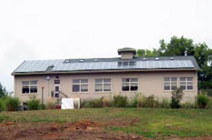 The public library in Esopus, New York, used Recovery Act funds to install two photovoltaic arrays expected to generate 31,200 kWh of electricity annually -- approximately 30 percent of the library’s electricity use and a savings of nearly $4,000 in energy costs each year. | Photo courtesy of New York State Energy Research and Development Authority (NYSERDA).