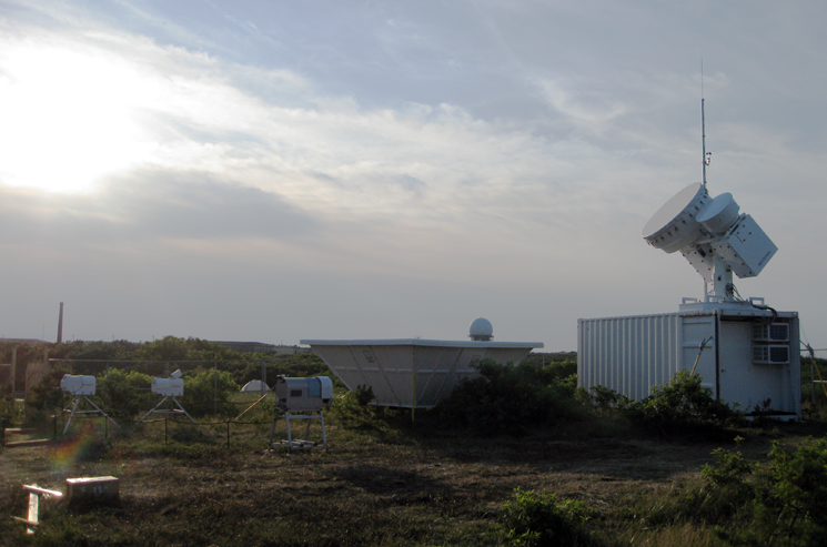 This observatory is part of an air particles research initiative at Cape Cod National Seashore in Massachusetts, and includes dozens of sophisticated instruments that take continuous ground-based measurements of clouds, aerosols, and other atmospheric properties. | Photo courtesy of the ARM Climate Research Facility. This observatory is part of an air particles research initiative at Cape Cod National Seashore in Massachusetts, and includes dozens of sophisticated instruments that take continuous ground-based measurements of clouds, aerosols, and other atmospheric properties. | Photo courtesy of the ARM Climate Research Facility.