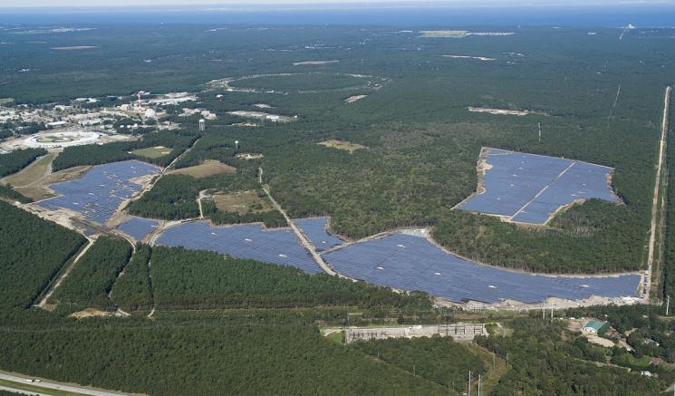 An aerial view of the 32-megawatt photovoltaic array of the Long Island Solar Farm, which will produce enough energy to power up to 4,500 local homes. The central Brookhaven National Laboratory campus is seen at left. An aerial view of the 32-megawatt photovoltaic array of the Long Island Solar Farm, which will produce enough energy to power up to 4,500 local homes. The central Brookhaven National Laboratory campus is seen at left.