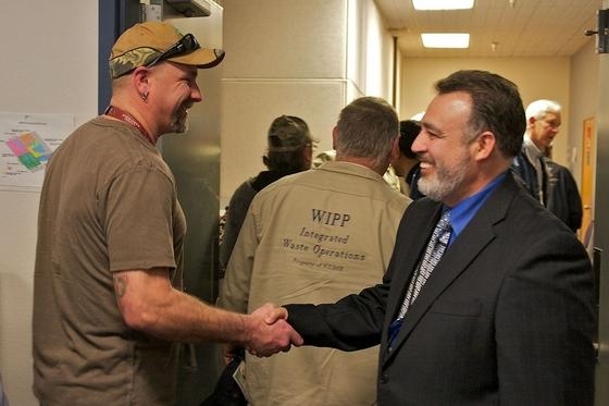 Carlsbad Field Office Manager Joe Franco, right, exchanges greetings with Mark Long, Jr.,
a Washington TRU Solutions LLC employee, at a WIPP all-hands meeting in February.
“WIPP is America’s only and the world’s best,” Franco said of the deep geologic repository
for nuclear waste. Carlsbad Field Office Manager Joe Franco, right, exchanges greetings with Mark Long, Jr.,
a Washington TRU Solutions LLC employee, at a WIPP all-hands meeting in February.
“WIPP is America’s only and the world’s best,” Franco said of the deep geologic repository
for nuclear waste.