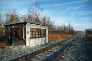 This railroad scale house, in West Kentucky Wildlife Management Area east of the Paducah site, was used
in the 1950s to weigh Paducah Gaseous Diffusion Plant freight. Workers preserved the old scale because of its potential historical significance. The scale house was demolished. This railroad scale house, in West Kentucky Wildlife Management Area east of the Paducah site, was used
in the 1950s to weigh Paducah Gaseous Diffusion Plant freight. Workers preserved the old scale because of its potential historical significance. The scale house was demolished.