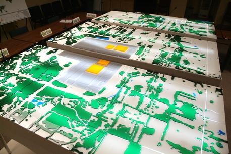 Shown at the Paducah Citizens Advisory Board office, this model depicts a 10-square-mile area around the Paducah site to a depth of several hundred feet. Yellow structures depict the site’s four large uranium hexafluoride process buildings. Shown at the Paducah Citizens Advisory Board office, this model depicts a 10-square-mile area around the Paducah site to a depth of several hundred feet. Yellow structures depict the site’s four large uranium hexafluoride process buildings.