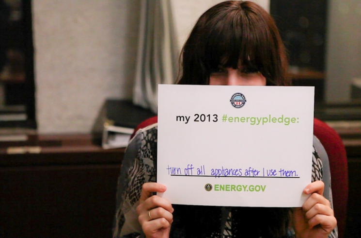 Download your own pledge card and submit a photo -- you might see yourself on energy.gov/pledge! Here, Amanda pledges to turn off all appliances when she's not using them to save energy. | Energy Department photo. Download your own pledge card and submit a photo -- you might see yourself on energy.gov/pledge! Here, Amanda pledges to turn off all appliances when she's not using them to save energy. | Energy Department photo.