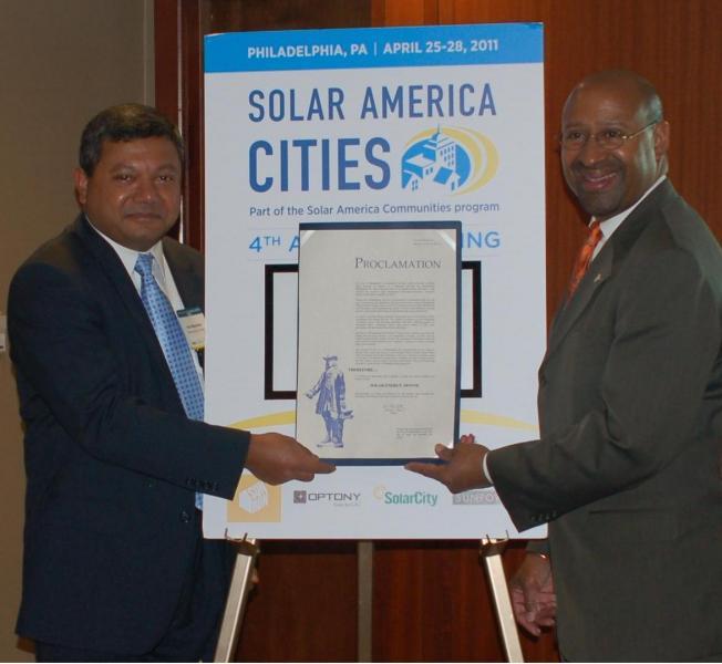 DOE Acting Under Secretary Dr. Arun Majumdar and Philadelphia Mayor Michael Nutter hold a Philadelphia Proclamation naming April Solar Energy Month. | Department of Energy Image | Photo by Susan Carollo, Contractor | Public Domain |