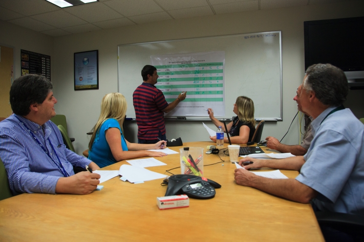Members of the Carlsbad Technical Assistance Contractor discuss audit criteria for quality assurance implementation.