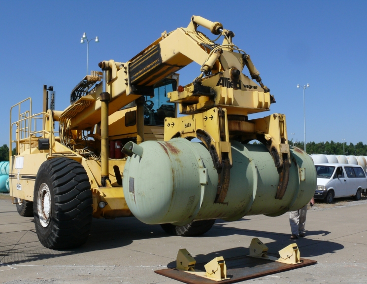 This cylinder hauler at Paducah’s Babcock & Wilcox Conversion Services plant delivers the first of DOE’s 14-ton depleted uranium cylinders to USEC for re-enrichment as part
of a five-party agreement that is extending enrichment operations at the 60-year-old plant for another year, delaying increased costs at the site for DOE. This cylinder hauler at Paducah’s Babcock & Wilcox Conversion Services plant delivers the first of DOE’s 14-ton depleted uranium cylinders to USEC for re-enrichment as part
of a five-party agreement that is extending enrichment operations at the 60-year-old plant for another year, delaying increased costs at the site for DOE.