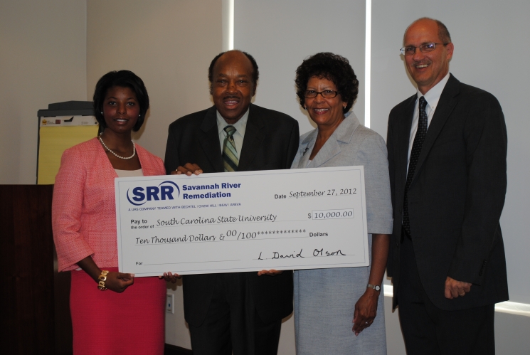 Savannah River Remediation presents a $10,000 to South Carolina State University  to support its Nuclear Engineering Program. In the photo, from left: Kayla Miller, Savannah River Remediation Procurement Department and South Carolina State University 2010 graduate; Dr. John Corbitt, Acting Chairman of the South Carolina State University Board of Trustees; Dr. Cynthia Warrick, Interim South Carolina State University President; and Dave Olson, Savannah River Remediation President and Project Manager.