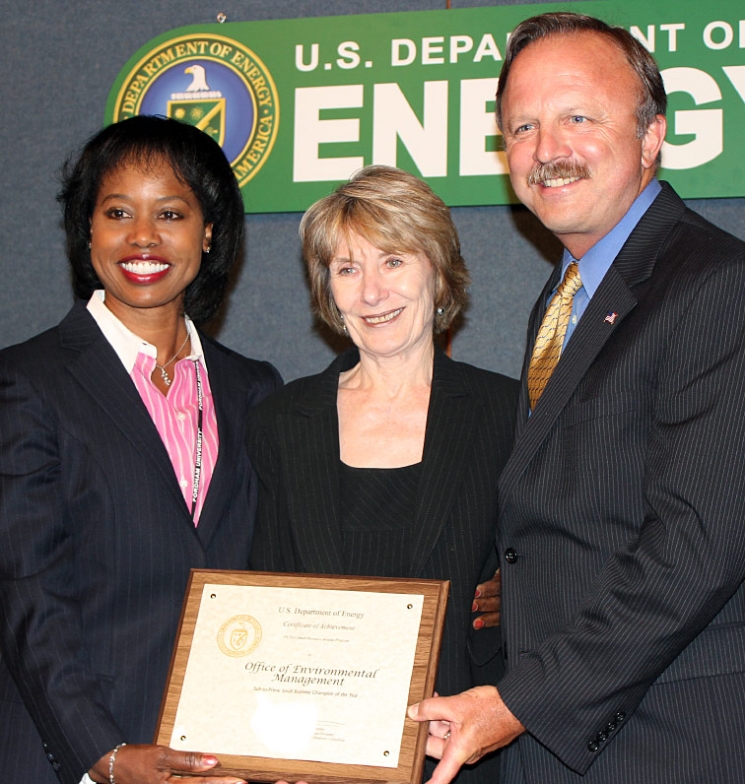 DOE Office of Economic Impact and Diversity Director Dot Harris, left, presents the Sub-to-Prime Small Business Champion of the Year Award to EM Small Business Advocate Kay Rash, center, and EM Deputy Assistant Secretary for Acquisition and Project Management Jack Surash during DOE’s Fiscal Year 2011 DOE Secretarial Small Business Awards Program Wednesday. DOE Office of Economic Impact and Diversity Director Dot Harris, left, presents the Sub-to-Prime Small Business Champion of the Year Award to EM Small Business Advocate Kay Rash, center, and EM Deputy Assistant Secretary for Acquisition and Project Management Jack Surash during DOE’s Fiscal Year 2011 DOE Secretarial Small Business Awards Program Wednesday.