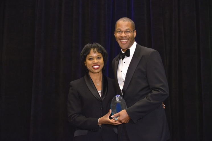 Director Dot Harris presents Chris Smith, Principal Deputy Assistant Secretary and Acting Assistant Secretary of Fossil Energy, with a professional achievement award at the Black Engineer of the Year Awards conference this February. Photo Credit: Nancy Jo Brown/106FOTO Director Dot Harris presents Chris Smith, Principal Deputy Assistant Secretary and Acting Assistant Secretary of Fossil Energy, with a professional achievement award at the Black Engineer of the Year Awards conference this February. Photo Credit: Nancy Jo Brown/106FOTO