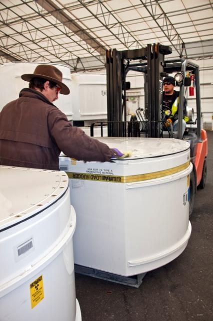 Workers move standard waste boxes to the High-Energy Real Time Radiography facility. Workers move standard waste boxes to the High-Energy Real Time Radiography facility.