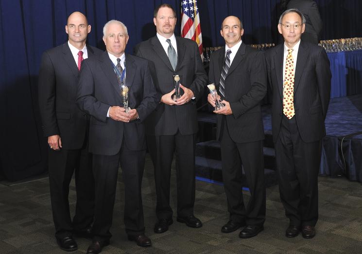 The Moab Uranium Mill Tailings Remedial Action Project Team with Secretary Steven Chu as they receive a Secretary of Energy Achievement Award. | Photo courtesy of the Energy Department