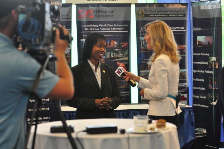 Dot Harris speaking live to WBIR, a local Knoxville television station, the morning of the Energy Department/National Nuclear Security Administration Small Business Summit (July 10). Photo: DOE Photographer Lynn Frenny