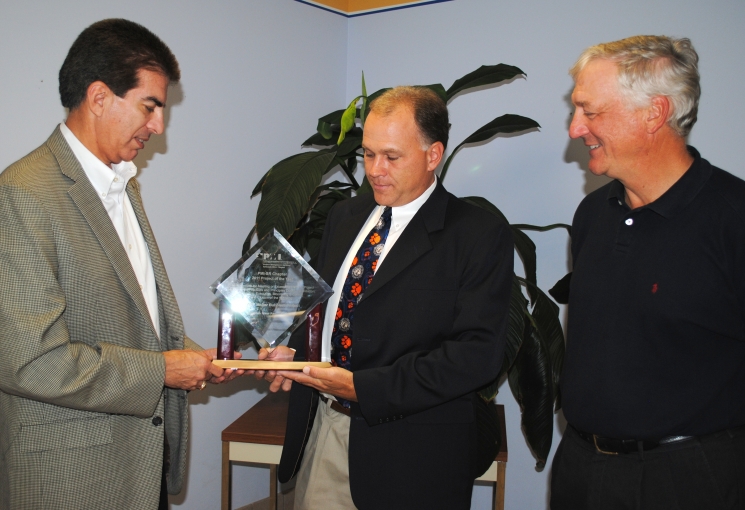 SRR Bubbler Project Manager Bill Pepper, center, accepts the PMI Project of the Year award from Eloy Saldivar, left, president of the Savannah River Chapter of PMI. DWPF Facility Manager Les Sonnenberg is on the right.
