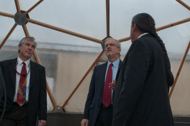 Umatilla Tribes Department of Science and Engineering Director Stuart Harris, far right, explains the purpose of the Tribes’ greenhouses to Senior Advisor for Environmental Management David Huizenga, center, and Richland Operations Office Manager Matt McCormick. Umatilla Tribes Department of Science and Engineering Director Stuart Harris, far right, explains the purpose of the Tribes’ greenhouses to Senior Advisor for Environmental Management David Huizenga, center, and Richland Operations Office Manager Matt McCormick.