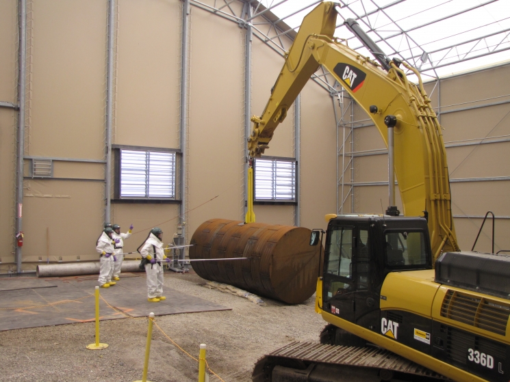 Employees receive training to remove Tank W-1A. From 1951 until 1986, the tank collected and stored liquid waste from radiochemical separations and high-radiation facilities at Oak Ridge National Laboratory, until significant levels of soil and groundwater contamination were traced to the vessel.