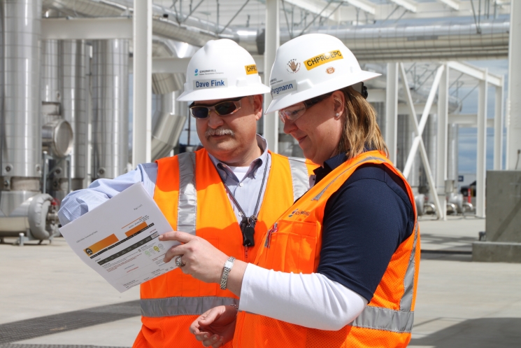 Pump-and-treat construction managers David Fink (left) and Delise Pargmann (right) review information for the LEED gold certification of the main process building for the 200 West Groundwater Treatment Facility. Pump-and-treat construction managers David Fink (left) and Delise Pargmann (right) review information for the LEED gold certification of the main process building for the 200 West Groundwater Treatment Facility.