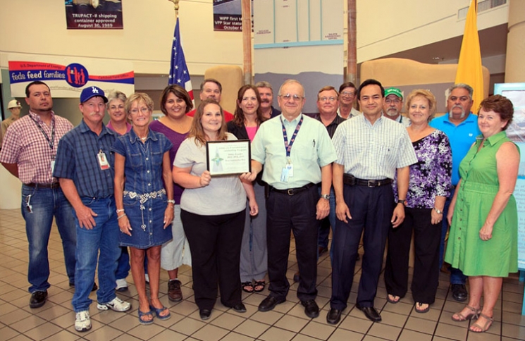 DOE Carlsbad Field Office Deputy Manager Ed Ziemianski presents a Waste Isolation Pilot Plant (WIPP) team with the Green Zia Program Silver Level Leader award from the New
Mexico Environment Department earlier this month in recognition of environmental initiatives. Shown right of Ziemianski is Farok Sharif, Washington TRU Solutions LLC, the WIPP management and operating contractor, President and General Manager. DOE Carlsbad Field Office Deputy Manager Ed Ziemianski presents a Waste Isolation Pilot Plant (WIPP) team with the Green Zia Program Silver Level Leader award from the New
Mexico Environment Department earlier this month in recognition of environmental initiatives. Shown right of Ziemianski is Farok Sharif, Washington TRU Solutions LLC, the WIPP management and operating contractor, President and General Manager.