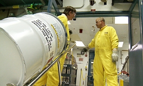 Workers relocate a pipe overpack container used to transport small amounts of excess plutonium oxide destined for long-term storage at the Waste Isolation Pilot Plant in Carlsbad, New Mexico. Workers relocate a pipe overpack container used to transport small amounts of excess plutonium oxide destined for long-term storage at the Waste Isolation Pilot Plant in Carlsbad, New Mexico.