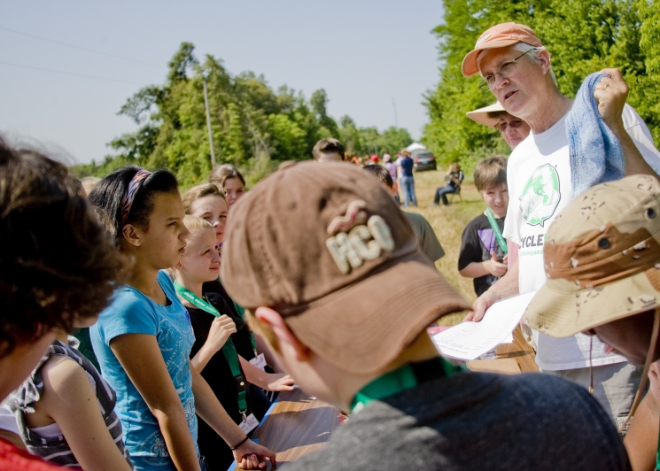 Ralph Young of Recycle Now! explains to Eco Fair attendees the value of recycling. Young is chairman of the Paducah Citizens Advisory Board, which advises the Department of Energy regarding cleanup issues at the Paducah site.