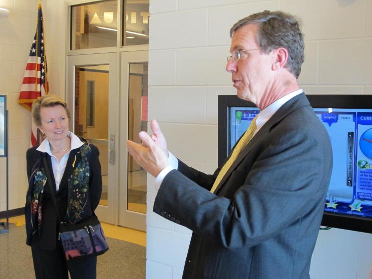 Roya Stanley (left) on a tour of the Snipes Academy of Arts and Design with the building's architect -- Thomas Hughes. Through interactive real-time energy data tools, Snipes students incorporate energy use data in their classroom projects and studies. | Photo Courtesy of the Cape Fear Green Building Alliance.