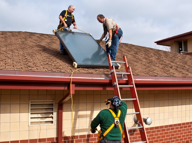 Installing a solar hot water system at a Milwaukee fire station. The installation was completed as part of the Midwest Renewable Energy Association's hands-on training workshop. System components were donated by local manufacturer, Caleffi. | Photo Courtesy of the National Renewable Energy Lab. Installing a solar hot water system at a Milwaukee fire station. The installation was completed as part of the Midwest Renewable Energy Association's hands-on training workshop. System components were donated by local manufacturer, Caleffi. | Photo Courtesy of the National Renewable Energy Lab.