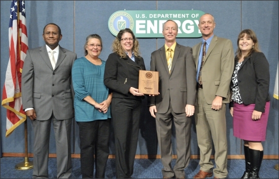 Award ceremony (left to right): Melvin G. Williams, Jr., Associate Deputy Secretary, U.S. Department of Energy (DOE);
Mary Sizemore, Environmental Management System (EMS) Coordinator, Office of Legacy Management (LM) contractor;
Tracy Ribeiro, EMS Coordinator, LM; Tom Pauling, Director of Site Operations, LM; Dave Geiser, Director, LM; and
Jennifer MacDonald, Director, Sustainability Performance Office, DOE. Award ceremony (left to right): Melvin G. Williams, Jr., Associate Deputy Secretary, U.S. Department of Energy (DOE);
Mary Sizemore, Environmental Management System (EMS) Coordinator, Office of Legacy Management (LM) contractor;
Tracy Ribeiro, EMS Coordinator, LM; Tom Pauling, Director of Site Operations, LM; Dave Geiser, Director, LM; and
Jennifer MacDonald, Director, Sustainability Performance Office, DOE.