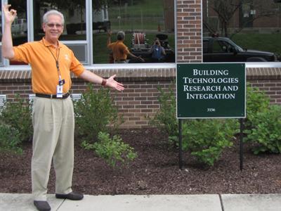 Norman Durfee, project manager at Oak Ridge National Laboratory, stands in front of Building 3156, the first DOE retrofit office building to receive a net-zero designation. | Department of Energy Photo | Courtesy of Oak Ridge National Laboratory | Public Domain | Norman Durfee, project manager at Oak Ridge National Laboratory, stands in front of Building 3156, the first DOE retrofit office building to receive a net-zero designation. | Department of Energy Photo | Courtesy of Oak Ridge National Laboratory | Public Domain |