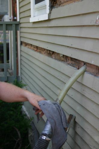 In existing homes, cellulose (here) or other loose-fill materials can be installed in building cavities through holes drilled (usually) on the exterior of the house. After the installation, the holes are plugged and finish materials replaced. | Photo courtesy of Cellulose Insulation Manufacturers Association. In existing homes, cellulose (here) or other loose-fill materials can be installed in building cavities through holes drilled (usually) on the exterior of the house. After the installation, the holes are plugged and finish materials replaced. | Photo courtesy of Cellulose Insulation Manufacturers Association.
