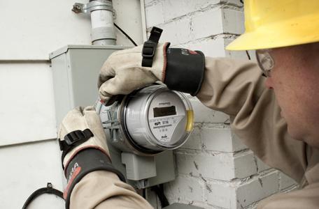 An employee installs a smart meter as part of a smart grid initiative by EPB. The project is supporting 390 jobs in the Chattanooga area. | Photo courtesy of EPB An employee installs a smart meter as part of a smart grid initiative by EPB. The project is supporting 390 jobs in the Chattanooga area. | Photo courtesy of EPB