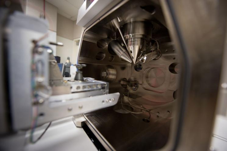 The inside of the specimen/vacuum chamber of NREL's FEI Nova 200 dual beam electron microscope used to analyze the topography of materials such as Innovalight's Silicon Ink. The instrument is used to produce site-specific sections for high spatial microstructural analysis. The inside of the specimen/vacuum chamber of NREL's FEI Nova 200 dual beam electron microscope used to analyze the topography of materials such as Innovalight's Silicon Ink. The instrument is used to produce site-specific sections for high spatial microstructural analysis.