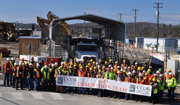 Employees with the K-25 demolition team gather for a photo following the completion of demolition of the north end of the K-25 Building today. Employees with the K-25 demolition team gather for a photo following the completion of demolition of the north end of the K-25 Building today.