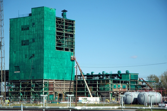 Workers remove panels from the Metals Plant in September 2012. Workers remove panels from the Metals Plant in September 2012.