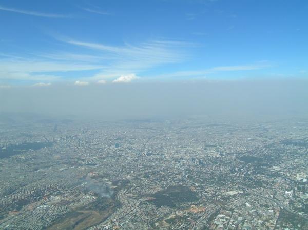 A heavy layer of air pollution, a mix of aerosol particles and vapors, obscures the view over Mexico City. Two studies by the Pacific Northwest National Laboratory show the importance of including the small-scale effects of aerosols in climate modeling. | Image courtesy of PNNL