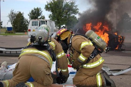 In a mock scenario, firefighters work with an accident victim during a Transportation Emergency Preparedness Program full field exercise In a mock scenario, firefighters work with an accident victim during a Transportation Emergency Preparedness Program full field exercise