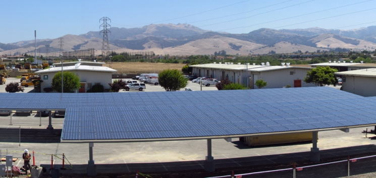 A portion of the new 141 kilowatt solar photovoltaic energy system at Monterey County’s Laurel Yard Complex in Salinas, California. The system is expected to save the county thousands of dollars a year in energy costs. <a href="http://energy.gov/sites/prod/files/monterey-california-solar-array-panorama.jpg">Click here</a> to see a panoramic view of the entire solar array. | Photo courtesy of Santa Cruz Westside Electric, DBA Sandbar. A portion of the new 141 kilowatt solar photovoltaic energy system at Monterey County’s Laurel Yard Complex in Salinas, California. The system is expected to save the county thousands of dollars a year in energy costs. <a href="http://energy.gov/sites/prod/files/monterey-california-solar-array-panorama.jpg">Click here</a> to see a panoramic view of the entire solar array. | Photo courtesy of Santa Cruz Westside Electric, DBA Sandbar.